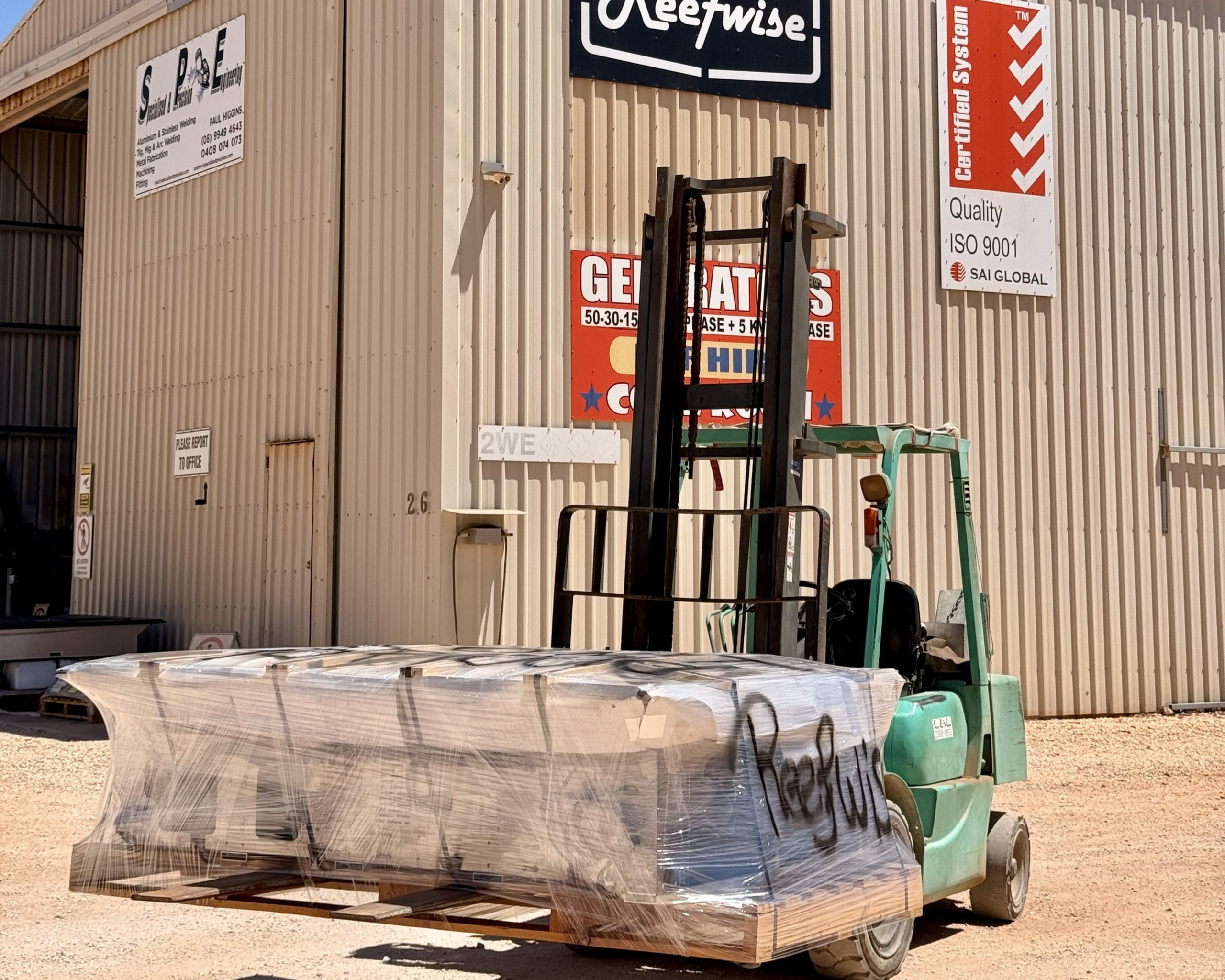 Forklift transporting wrapped materials outside