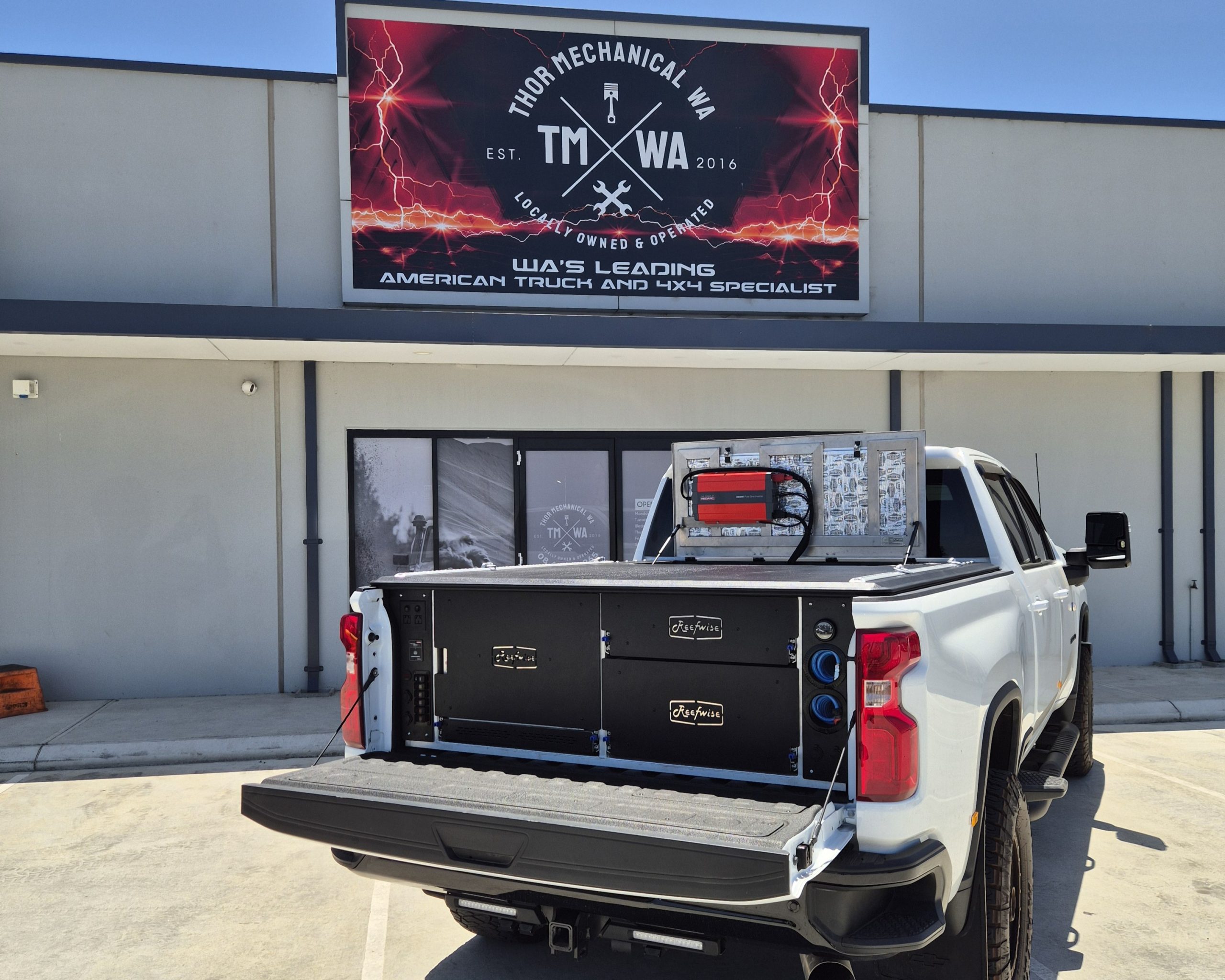 White truck with open canopy display
