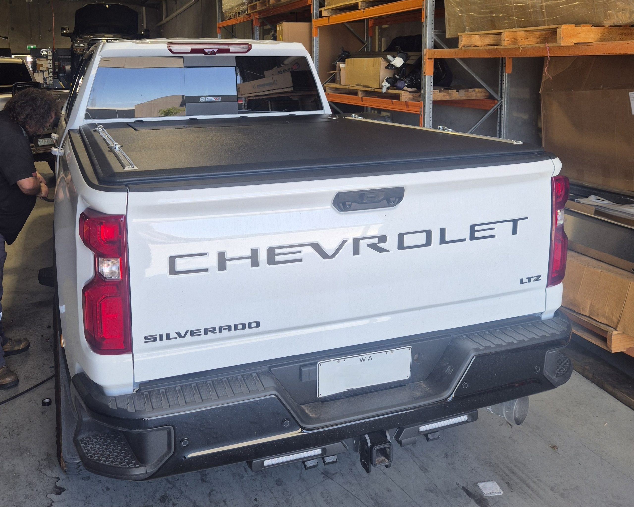 White Chevrolet Silverado with cover