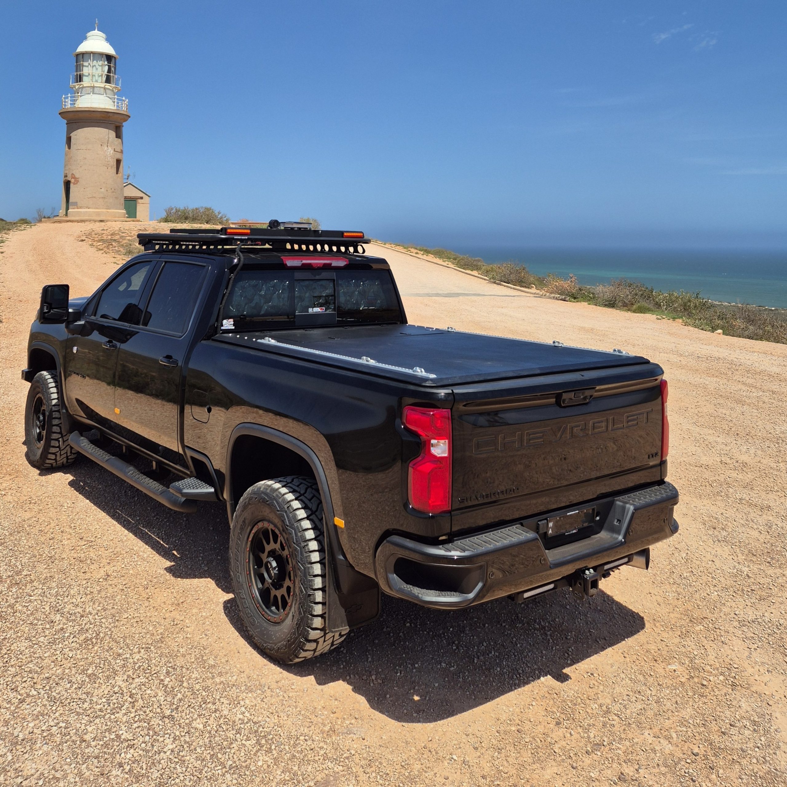 White Chevrolet Silverado with cover