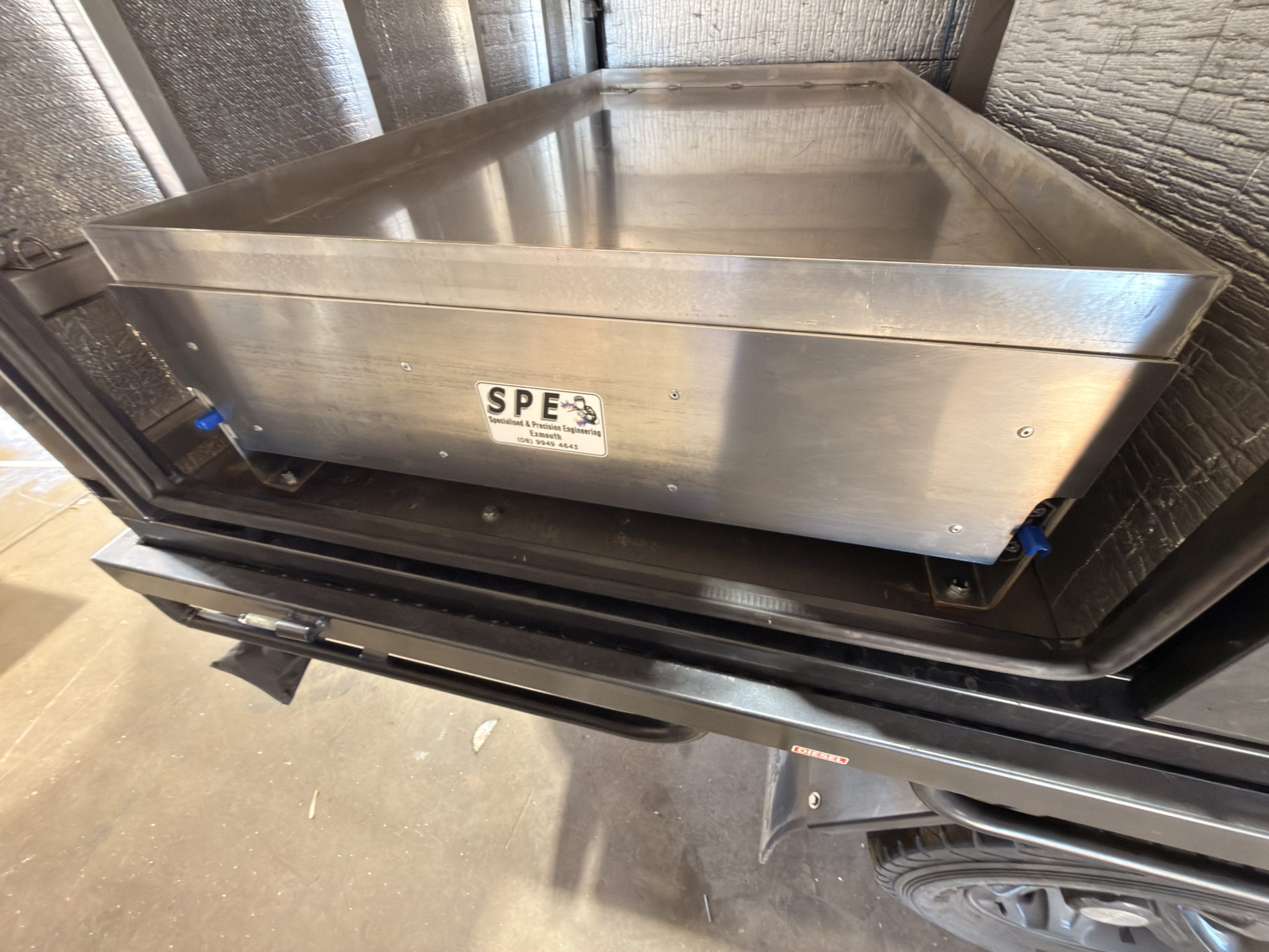 Double sided canopy drawer tie down points